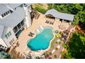 Aerial view of a backyard with a large pool, outdoor kitchen, and patio area at 3013 Walker Hill Way, Marietta, GA 30064
