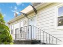 Inviting entrance featuring a railed stairway leading to a cozy home at 286 Booker Sw St, Atlanta, GA 30315