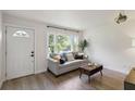Inviting living room featuring hardwood floors and a comfortable couch with natural light at 286 Booker Sw St, Atlanta, GA 30315