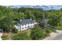 Expansive aerial view of a gracious two-story residence, showcasing its generous lawn and convenient proximity to neighborhood at 6104 Floyd St, Covington, GA 30014