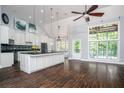 Bright kitchen with granite counters, large island, and stainless steel appliances at 704 Willowwind Dr, Loganville, GA 30052
