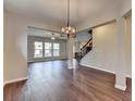 Open floorplan with hardwood floors, lots of light, and neutral colors at 1345 Aster Ives Dr, Lawrenceville, GA 30045