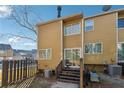 Backyard of a townhouse featuring a small deck with stairs, fenced in, and patio area at 213 Yuba Walk, Lawrenceville, GA 30046