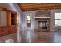 Living room showcases a stone fireplace, hardwood floors, built-in shelving and natural light at 3572 Dexter Way, Marietta, GA 30062