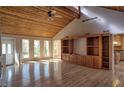 Spacious living room with wood ceiling, gleaming hardwood floors, and built-in shelving at 3572 Dexter Way, Marietta, GA 30062