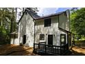 Back exterior view of the home featuring a deck and siding at 381 Fleming Ct, Jonesboro, GA 30238