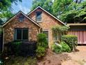 Charming brick home with a quaint front entrance and mature landscaping at 725 Brown Pl, Decatur, GA 30030