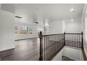 Bright interior featuring hardwood floors, ample windows, and an elegant staircase at 1892 Buford Dam Rd, Buford, GA 30518