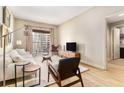 Cozy living room with contemporary decor, wood floors and a balcony view at 195 14Th St # 1501, Atlanta, GA 30309