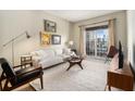 Bright living room with modern furniture, large windows, and city views at 195 14Th St # 1501, Atlanta, GA 30309