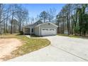 Lovely single-story home with an attached two-car garage and long driveway at 195 Willow Way, Stockbridge, GA 30281