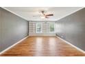 Spacious bedroom with hardwood floors, built-in shelving and ample natural light at 3734 Fox Hills Se Dr, Marietta, GA 30067