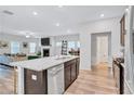 Open-concept kitchen with stainless steel appliances, a kitchen island, and an open view into the living room at 4658 Electric Sw Ave, Mableton, GA 30126
