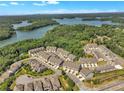 Aerial view of a waterfront community with lush green surroundings and stunning lake views at 1610 Habersham Villa Dr, Cumming, GA 30041