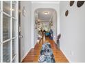 Inviting entryway with hardwood floors and an arched doorway, complemented by modern decor and ample natural light at 3040 Clear View Ln, Snellville, GA 30078