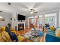 Cozy living room features a fireplace, hardwood floors, and an open floor plan, perfect for entertaining guests at 3040 Clear View Ln, Snellville, GA 30078