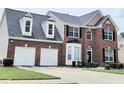 Attractive two-story brick home with a two car garage and well manicured lawn at 3703 Liberty Sw Dr, Powder Springs, GA 30127