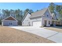 Stylish single-Gathering home with an attached garage, separate building, and concrete driveway at 510 Boulder View Parkway, Dallas, GA 30157