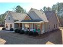 Beautiful single-Gathering home featuring wood and brick accents and a charming front porch at 510 Boulder View Parkway, Dallas, GA 30157