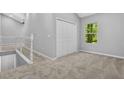Bright bedroom with neutral walls, carpeted floor, and a closet, offering a calm and inviting atmosphere at 1080 Westmont Sw Rd, Atlanta, GA 30311