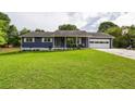 Single-story house features a well-kept lawn and attached garage, perfect for comfortable living at 4812 Pamela Nw Ct, Acworth, GA 30101
