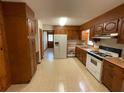 Functional kitchen with ample cabinet space, tile floors, and modern appliances at 5760 Brenda Sw Dr, Mableton, GA 30126