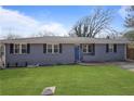 Charming single-story home with a well-maintained front lawn and blue door at 2222 Hill Nw St, Atlanta, GA 30318