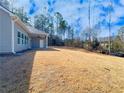 Expansive backyard featuring lush greenery providing ample space for outdoor activities and relaxation at 5096 Cumberland Ct, Villa Rica, GA 30180