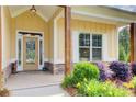 Inviting front porch with stone accents and decorative plants enhancing curb appeal at 608 Red Leaf Way, Canton, GA 30114