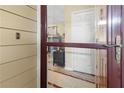 Close-up of front door with glass and view into the home's interior at 690 Mcgill Ne Pl, Atlanta, GA 30312