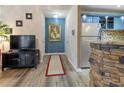 Hallway with modern flooring, accent wall, and view to the kitchen at 690 Mcgill Ne Pl, Atlanta, GA 30312