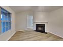 Bright living room featuring a decorative fireplace and ample natural light at 943 Colvin Dr, Locust Grove, GA 30248