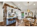 Modern kitchen with white cabinets, stainless steel appliances, and a breakfast bar at 901 United Se Ave, Atlanta, GA 30316