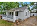 Charming single-story house featuring freshly painted light gray siding and inviting front porch at 1939 Dunlap Ave, Atlanta, GA 30344