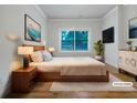 Serene bedroom featuring a plush queen bed, side tables, modern decor, and soft lighting for a cozy retreat at 2419 Boulder Se Rd, Atlanta, GA 30316