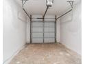 Spacious two car garage featuring a garage door opener and concrete floor at 4011 Redan Rd # 7, Stone Mountain, GA 30083