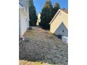 View of the backyard showing ample space and a generator at 4874 Larkspur Ln, Atlanta, GA 30349