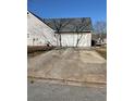 Spacious two-car garage with a long driveway for extra parking at 4874 Larkspur Ln, Atlanta, GA 30349