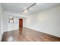 Spacious living room with hardwood flooring, natural light and modern lighting fixtures at 199 14Th St # 409, Atlanta, GA 30309