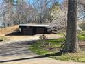 Detached two-car garage featuring rustic sliding doors at 3721 Mason Creek Rd, Winston, GA 30187
