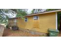 The house has a wood exterior, several windows, and a back entrance at 45 James P Brawley Nw Dr, Atlanta, GA 30314