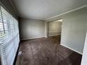 Open living room with large window and neutral decor at 675 Stonebridge Loop, Lithonia, GA 30058