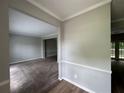 Spacious living room featuring fresh paint, new carpet and bright lighting at 675 Stonebridge Loop, Lithonia, GA 30058