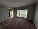 Inviting living room with large window and open floor plan at 675 Stonebridge Loop, Lithonia, GA 30058