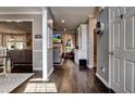 Hallway view featuring hardwood floors, neutral walls, and an open view into the living room at 1120 Bentwater Dr, Acworth, GA 30101