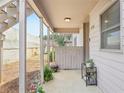 Covered porch with potted plants, providing a cozy and inviting outdoor space at 4216 Stillwater Dr, Duluth, GA 30096