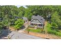 An aerial shot showcasing the home's well-maintained yard and proximity to mature trees at 1402 Sw Belmont Sw Ave, Atlanta, GA 30310
