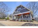Charming gray home with a landscaped front yard, showcasing its inviting curb appeal at 1402 Sw Belmont Sw Ave, Atlanta, GA 30310
