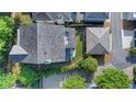 Aerial view of a home showcasing the roof, patio area with furniture, and landscaping at 6575 Eli Davis Rd, Cumming, GA 30040