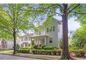 Charming two-story home with a welcoming front porch and mature trees at 6575 Eli Davis Rd, Cumming, GA 30040